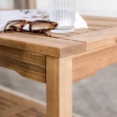 Ravenscroft Modern Boho Acacia Wood Slatted Outdoor Coffee Table With Lower Shelf - Saracina Home 8 Ravenscroft Modern Boho Acacia Wood Slatted Outdoor Coffee Table With Lower Shelf - Saracina Home - Image 6