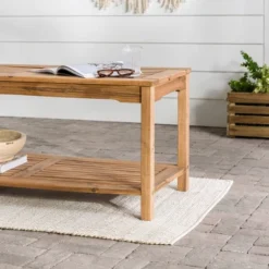 Ravenscroft Modern Boho Acacia Wood Slatted Outdoor Coffee Table With Lower Shelf - Saracina Home 22 Ravenscroft Modern Boho Acacia Wood Slatted Outdoor Coffee Table With Lower Shelf - Saracina Home -Saracina Home Shop GUEST a2c6185f 7488 49a4 9161 ec2e2e671ad4